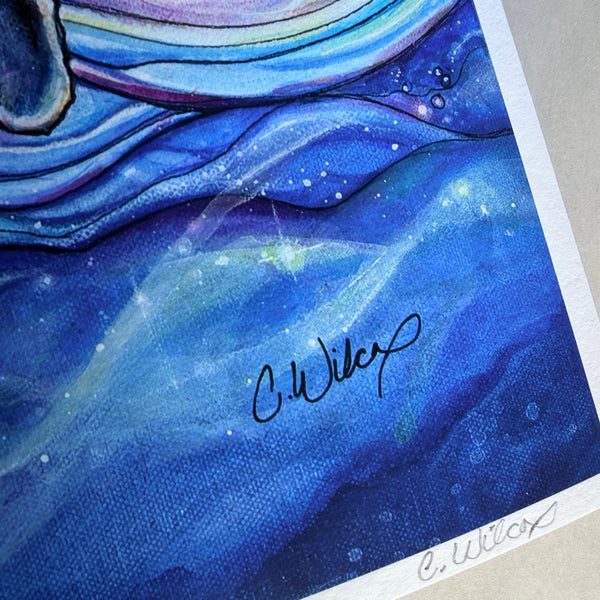 Blue abstract painting with a signature at the bottom right corner